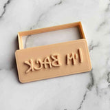 I'm back text embosser fondant cutter for cookies, cupcakes and biscuits.