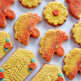 Hand Handle Fan that seems like a peacock feather fan cookies made from bakers