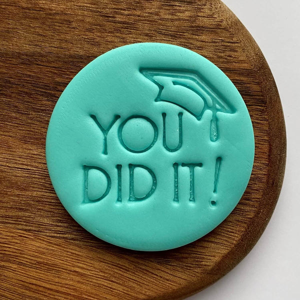 You did it with hat fondant embosser stamp for graduation