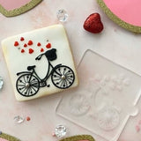 Bicycle with hearts cookies made from bakers using out cookie stamp.