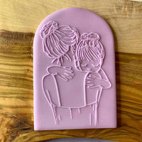 Mother and daughter icing popup cookie cutter .
