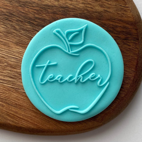 Cookie embosser stamp apple shape with teacher text in the middle