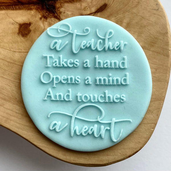 A teacher takes a hand, opens a mind and touches a heart cookie stamp